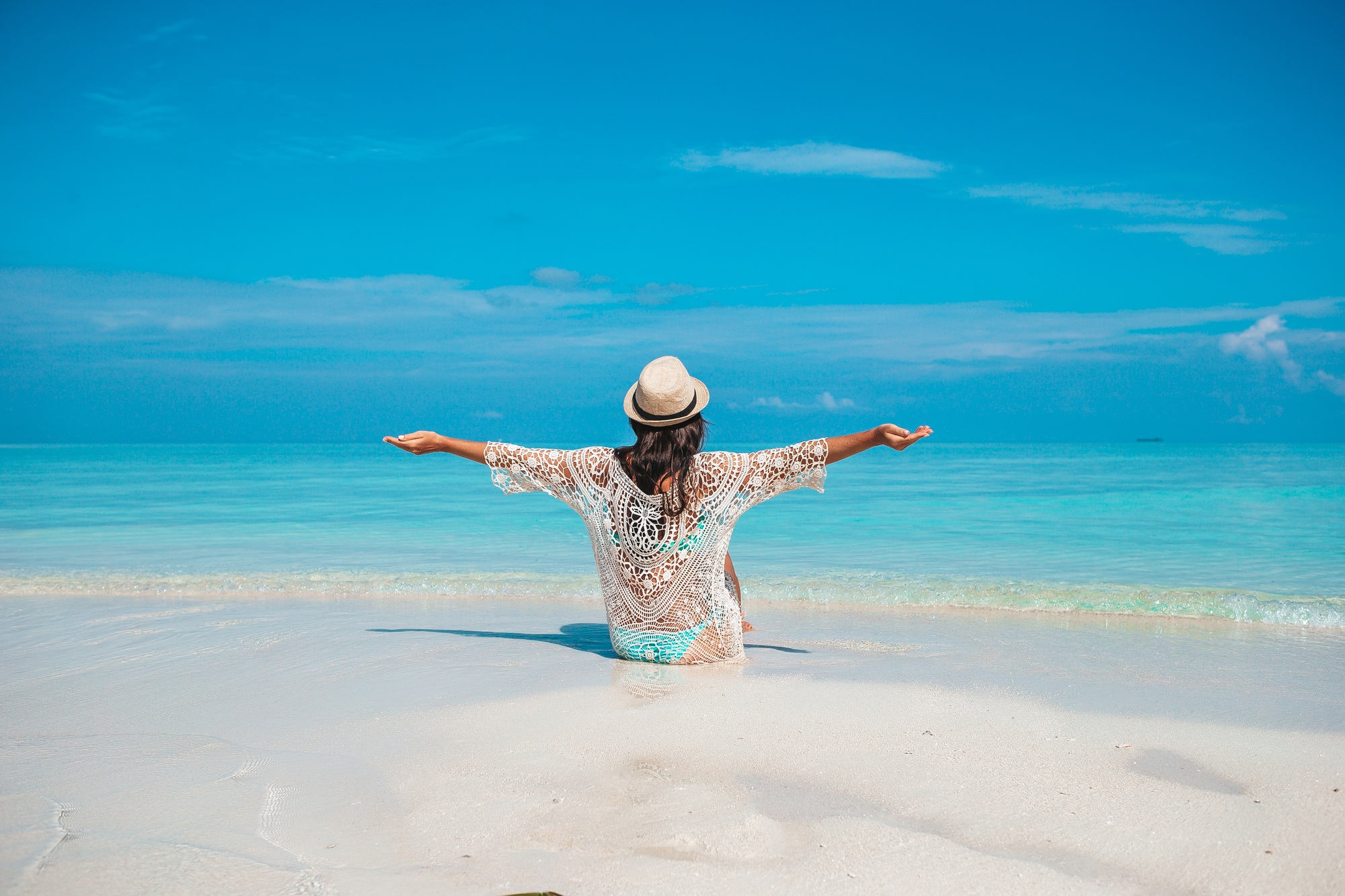 Young beautiful woman on beach vacation